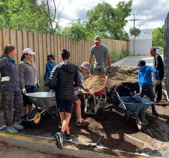Children and adults gardening together at the Wanaka Community Garden LINK